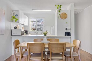 The open-plan kitchen and dining area is designed to accomodate families or groups.
