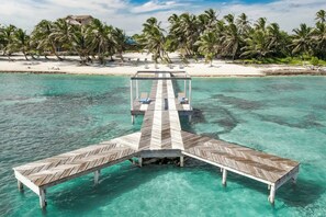 Secluded Waterfront Oasis! Nestled along the private estates shoreline, the dock provides a secluded escape for contemplation, where the gentle lapping of the waves serves as a soothing soundtrack to your moments of relaxation.
