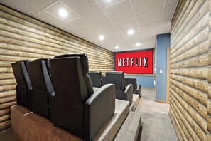 Kick back in plush recliners and enjoy a true cinematic experience in this private home theater. Perfect for movie marathons or game-day watch parties, this cozy space is designed for ultimate entertainment and relaxation.