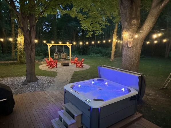 6 person hot tub, firepit and barbeque grill.