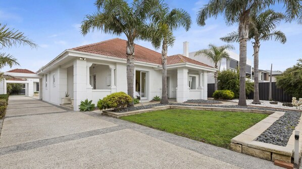 Driveway with secure gates and fully fenced.