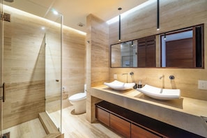 Immaculate bathroom with a large vanity and plenty of storage