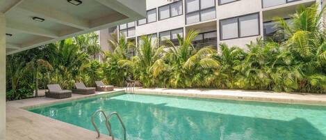 Dive into relaxation in our sparkling swimming pool