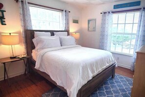 Queen sized bed that faces the west (street side). 