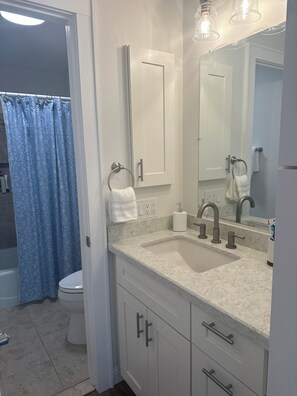 primary bathroom with 2 vanities