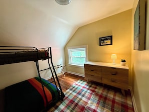Secondary bedroom upstairs with dresser full bottom and twin top bunk