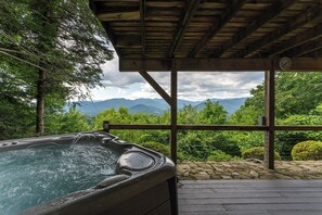 8-person hot tub, located on the lower deck, overlooking long-range mountain views