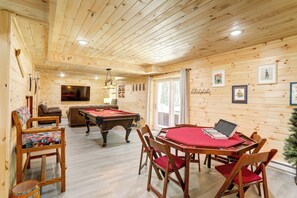 Gather in the basement game area for billiards and cards.