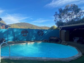 Outdoor pool available for guest use - heated through summer months. 