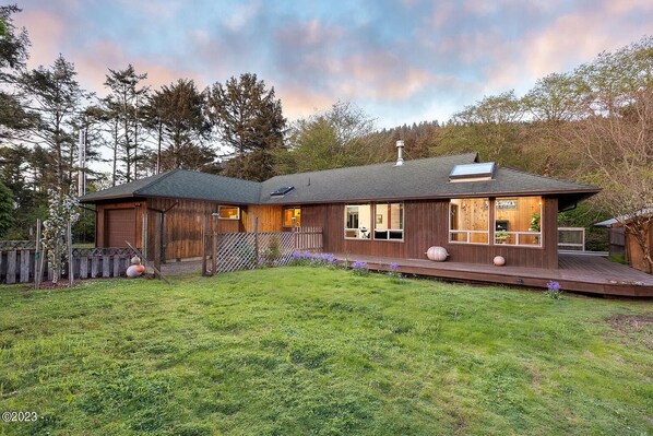 1/2 acre fenced yard and wraparound deck