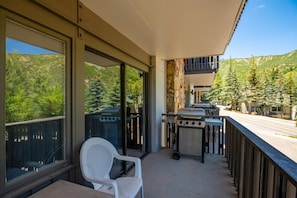 The balcony offers views of the surrounding mountains and a gas grill.  You will enjoy preparing dinner out here while soaking in the views!