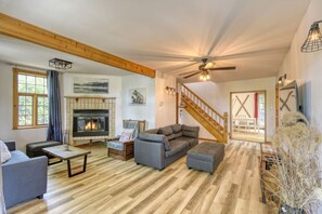Spacious living area featuring a warm wood theme, perfect for comfortable gatherings and relaxing moments.
