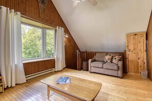 Warm and inviting wood-themed living area upstairs, ideal for cozy moments and quality time with loved ones.