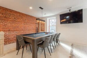 Convertible dining table that easily transforms into a billiard table—dine and play in one stylish space.