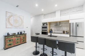 Classy grey and black countertop with a sleek bar area—perfect for entertaining.