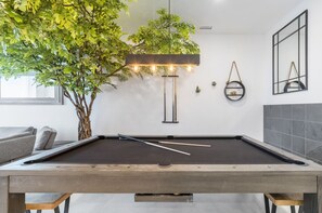 Versatile dining table that easily transforms into a billiard table for added fun and entertainment.