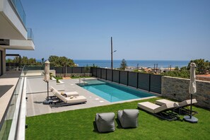 Dive into the 40m² pool with hydromassage features, perfect for relaxation.