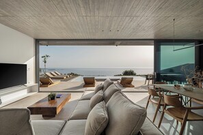 Open plan living and kitchen area with direct outdoor access