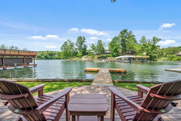 Relax in the adirondack chairs by the water