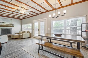 Open-concept living and dining space with high ceilings and natural light.