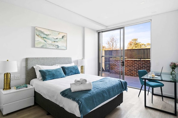 Main bedroom with Queen Bed, built-in-robes and dedicated work space.