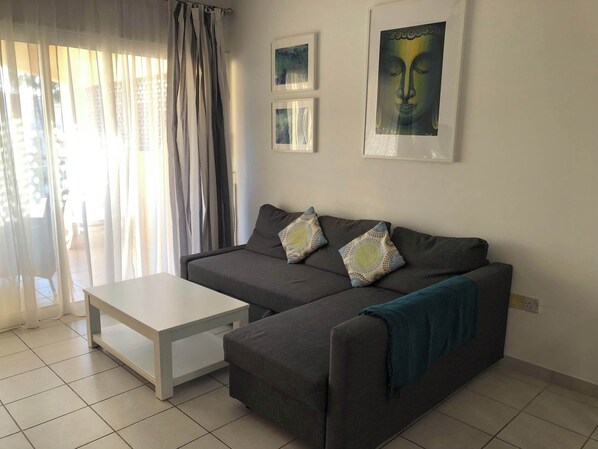 Contemporary living room leading to covered patio 
