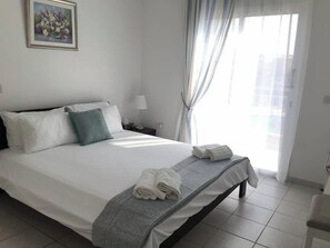 Queen sized bed, leading onto patio