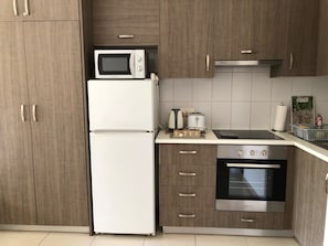 Stove, microwave, oven and fridge