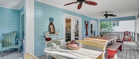 Outdoor dining table at the screened porch that seats 18