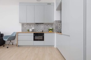 Kitchenette with a kettle.