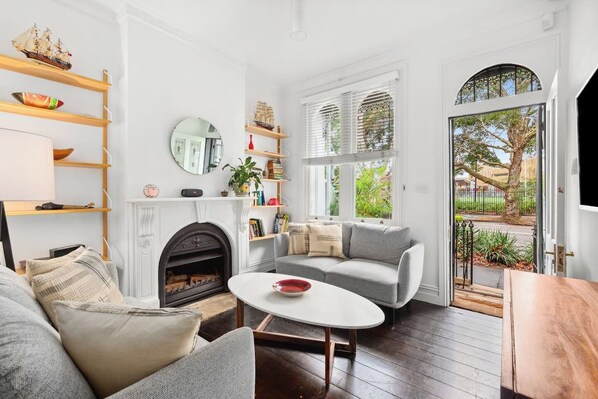 Relax on the sofas with a spot of TV in the living area. Please note that the fireplace is decorative and not functional.
