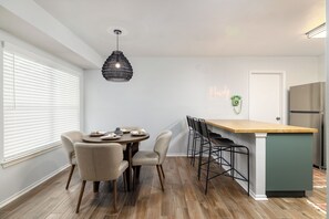 Dining area with kitchen island beside