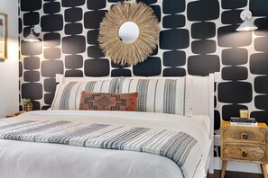A king bed fit for royalty in a stylish primary suite