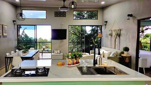 Open concept common area.  Access to balcony thru 2 sliding doors.