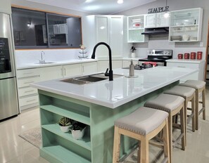 Large kitchen equipped with everything needed to cook meals.