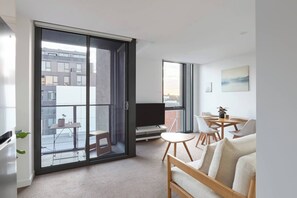 Lay back on the lounge and rest in this tranquil living room with a flat-screen TV.
