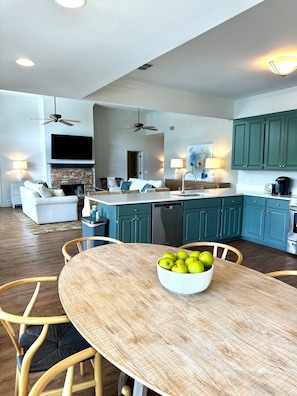 View of kitchen into den