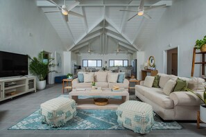Open concept living with views to the pool and patio.