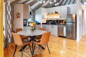 Table for 4 in an open design allows conversations to flow with the chef.