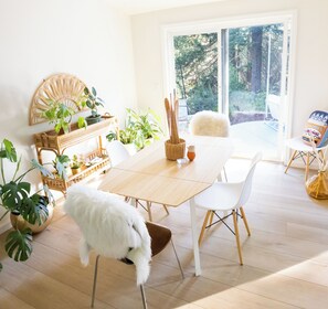 Slider in eating area opens to spacious patio with comfortable 10 foot sofa.