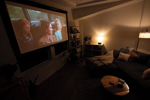 Movie Room. 120" screen + easy to use smart projector for movie night.