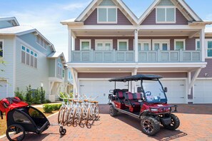 Home comes with a 6 seater golf cart, 6 adults bikes and a Burley.
