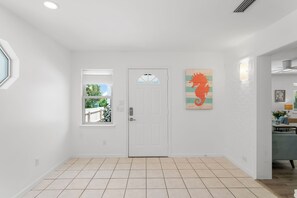 Entry into house, doorway leads to main living area.