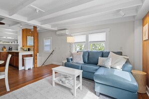 The interior staircase leads directly into the kitchen and living room.