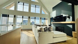 Relax in a spacious, bright and cozy family room with beautiful water views.