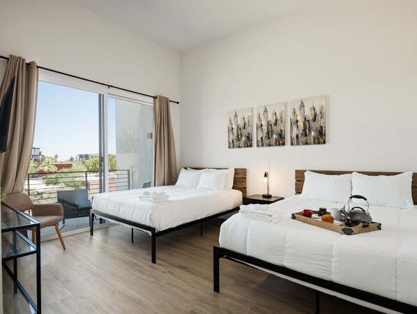 2nd Floor: Primary Bedroom featuring 2 Queen Beds, a Smart TV, a private balcony, and an ensuite primary bathroom.