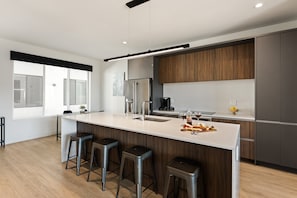 1st Floor: Fully equipped modern kitchen completely stocked with all culinary essentials and includes high-end Cafe stainless steel appliances.