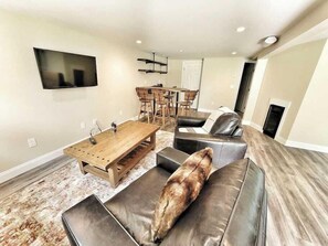 Second living room and pool table downstairs.