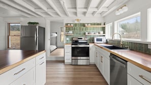 Large fully equipped kitchen with large island and fully equipped coffee bar
