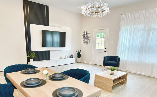 Modern living room with sleek furniture and bold decor. 